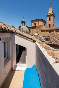 a view from the roof of a building with a blue slide at Dimora Condivi in Ripatransone