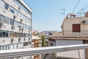 a view from the balcony of a building at Spacious 3 bedroom apt in Eksarchia in Athens