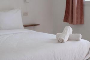 Katil atau katil-katil dalam bilik di Jasmine Resort