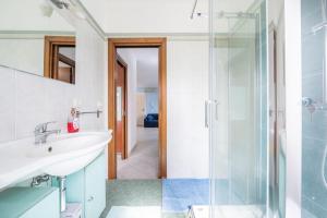 a bathroom with a sink and a shower at Casa Murru in SantʼAntìoco