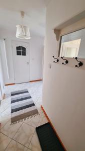 a room with a refrigerator with two dogs on the wall at Penthouse Mały Belweder in Ustrzyki Dolne