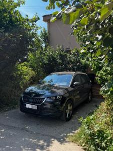 a black car parked in front of a house at Green place in Bar