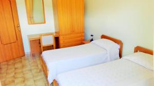 Letto o letti in una camera di Albergo Grumentum