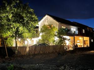 a house with a car parked in front of it at night at Star Wish B&B in Dongshan