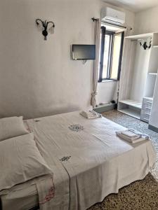 A bed or beds in a room at Il Gaza