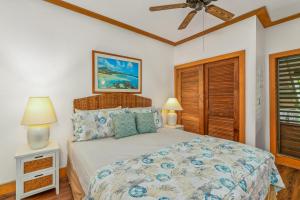 a bedroom with a bed and a ceiling fan at Charming 1br TopFloor Condo in Poipu, Athletic Club 432 in Koloa +19 photos