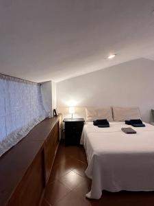 Postel nebo postele na pokoji v ubytování B&B RIO GRANDE