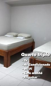 Ліжко або ліжка в номері POUSADA HOTEL SANTO ANTÔNIO