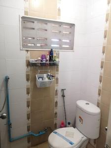 a small bathroom with a toilet in a room at COZY HOUSE Working Space Stay with local in Bangkok Airport in Bangna +3 photos