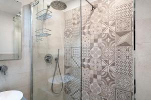 a bathroom with a shower with a glass door at Casa Elena in Bordighera +12 photos