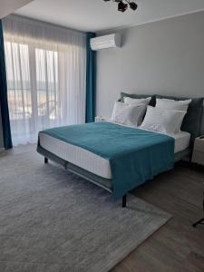 En eller flere senge i et værelse på Studio 64 by ZORA Rezidetial