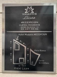 a chalkboard with a sign for a hotel at Hotel Madanis Liceo in Hospitalet de Llobregat
