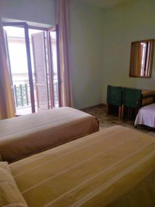 Letto o letti in una camera di Albergo Grumentum