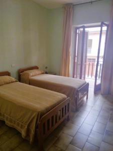 Letto o letti in una camera di Albergo Grumentum