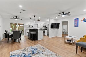 a living room with a kitchen and a dining room at Gainesville-newly remodeled home in Gainesville