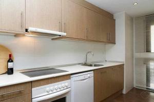 a kitchen with a sink and a counter top at Port III Apart céntrico ideal familias 11 in Barcelona