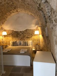 Ένα ή περισσότερα κρεβάτια σε δωμάτιο στο Cà Giò
