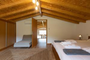 Postel nebo postele na pokoji v ubytování Abraços dos Avós - Casas do Monte + 70 fotografií