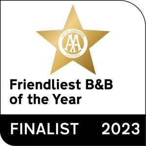 a star with the international bbb of the year logo at Lion House Bed & Breakfast with Restaurant in Combe Martin