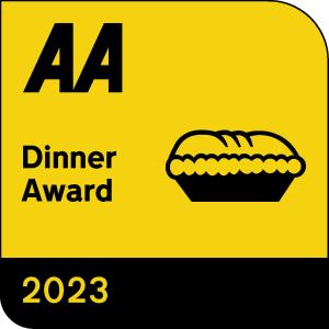 a yellow sign that reads dinner award with a pumpkin on it at Lion House Bed & Breakfast with Restaurant in Combe Martin