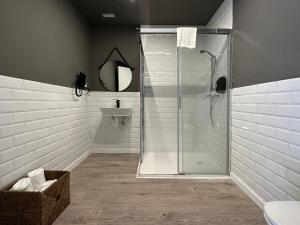 a bathroom with a shower and a sink at Hostal María Felisa in Candás