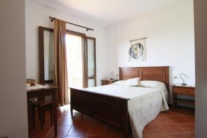 A bed or beds in a room at Agriturismo La Steccaia Alta