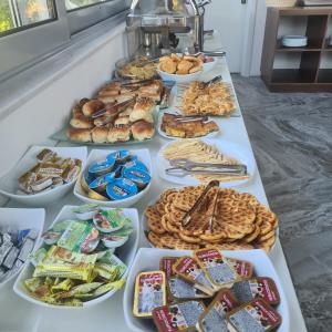 a buffet of different types of food on a table at Sunrise Apart-Hotel in Ulcinj