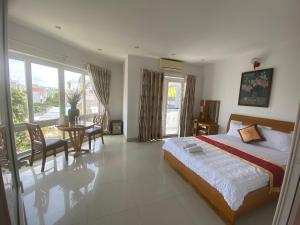 Postel nebo postele na pokoji v ubytování Đức Anh HoTel Vũng Tàu
