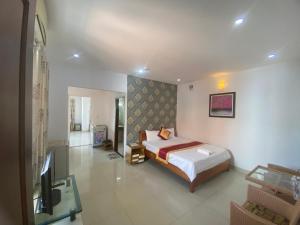 Postel nebo postele na pokoji v ubytování Đức Anh HoTel Vũng Tàu