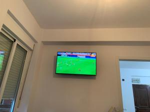 a television hanging on a wall in a room at Piso Attila in Sanxenxo