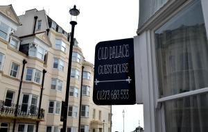 a sign on the side of a building at Old Palace Guest House in Brighton & Hove +42 photos