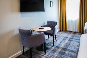 TV a/nebo společenská místnost v ubytování Almondsbury Inn & Lounge