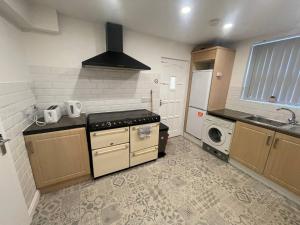 A kitchen or kitchenette at Boutique Accommodation in Central Location