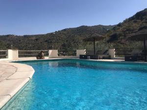 Der Swimmingpool an oder in der Nähe von Cortijo Cuscurro