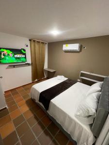 Voodi või voodid majutusasutuse Hotel Valle Central toas
