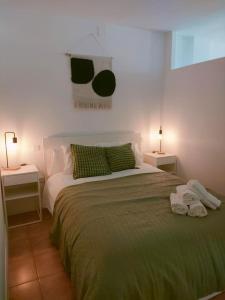 a bedroom with a large bed with two night stands at San Centro Wizink IFEMA Metropolitano Airport Apartments in Madrid
