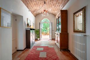 a hallway with a large entry way with a large window at Agriturismo Terre della Rinascita in Castelnuovo della Misericordia