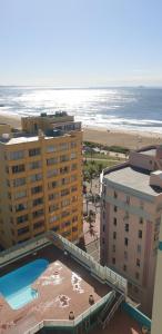 a view of the beach from the balcony of a resort at 1403 on 10 South Beach in Durban
