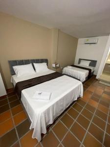 Voodi või voodid majutusasutuse Hotel Valle Central toas