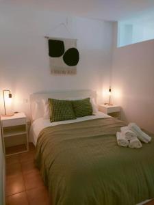 a bedroom with a large bed with two night stands at San Centro Airport IFEMA Wizink Metropolitano Apartments in Madrid
