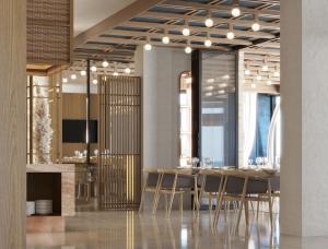 a dining room with a table and chairs at Volmar Hotel in Durrës