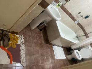 an overhead view of a bathroom with a sink and a toilet at Lux Suites Lantana Road Apartments westlands in Nairobi