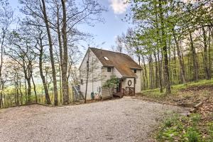 a home in the woods with a driveway at Serene Hideaway with Views, 1 Mi to Hike and Ski! in Wintergreen