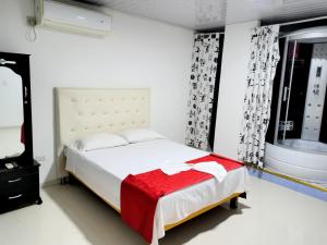 Voodi või voodid majutusasutuse Hotel flamingo real T toas