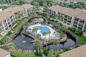 an aerial view of a resort with a swimming pool at Modern oceanfront condo with two pools & private washer/dryer in Saint Augustine