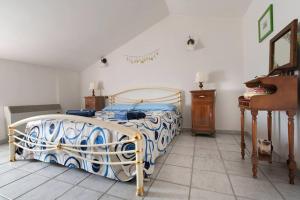 a bedroom with a bed and a piano at La collina degli Olivi in Spina