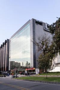 a large glass building with a lot of windows at Soy Local Usaquen in Bogotá