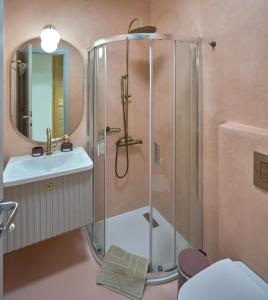 a bathroom with a shower and a sink at Into The Blue Suites in Arkadiko Chorio