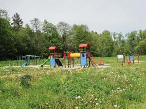 a park with a playground in a field at Chalupa pod vysokou in Ludvíkov