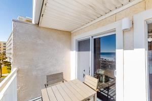 a balcony with a table and a view of the ocean at Island Sands 306 in Fort Walton Beach